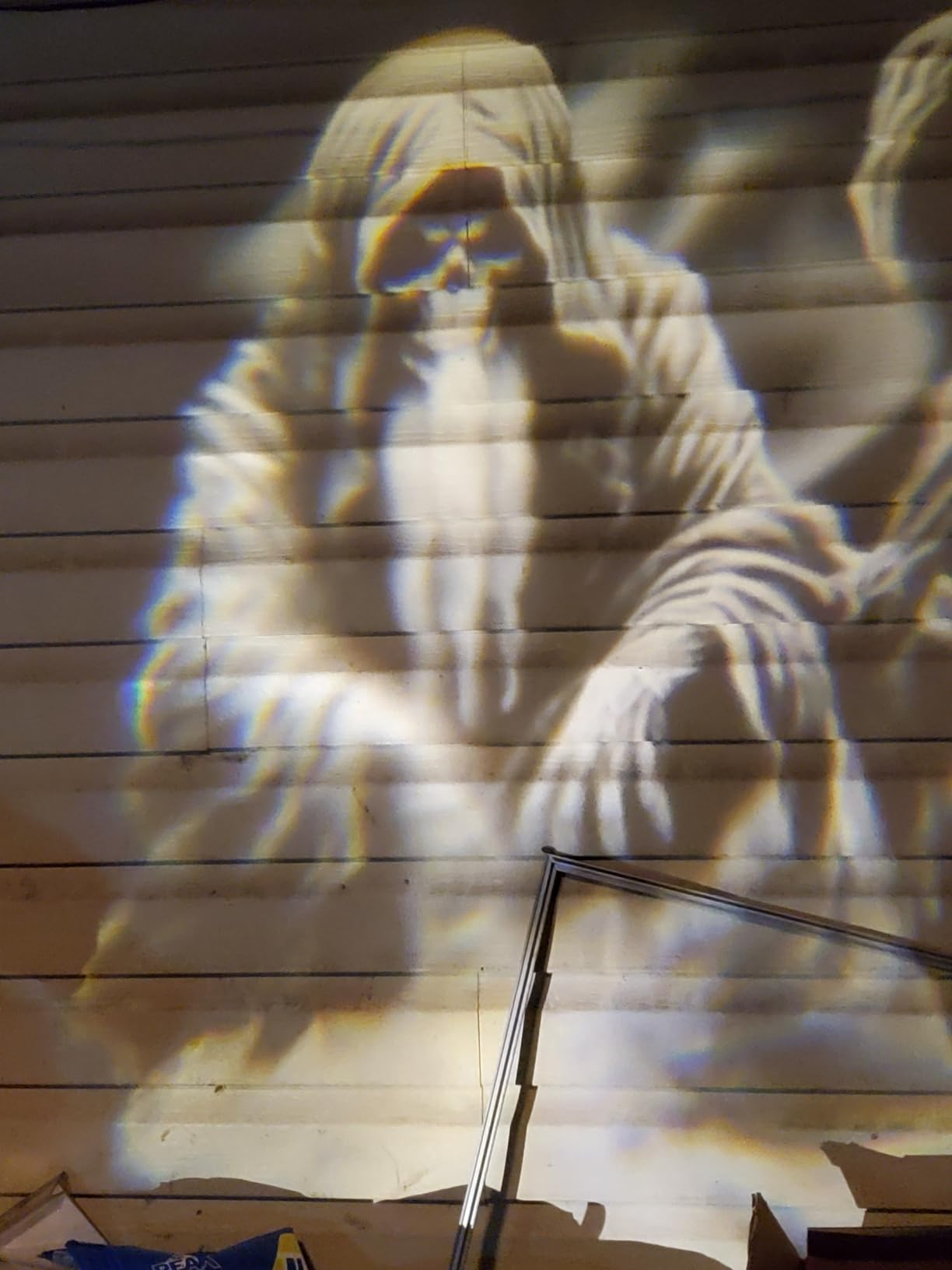 Witch scene projected on a customer's house